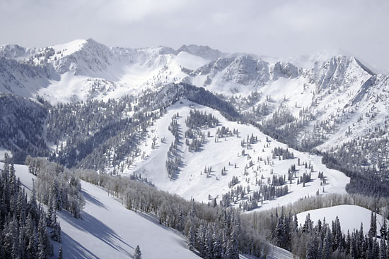 Ski runs at Solitude Resort. Honeycomb canyon, Wolverine Peak, and in the back Devil's Castle and Sugarloaf at Alta in Utah's Wasatch Mountains.